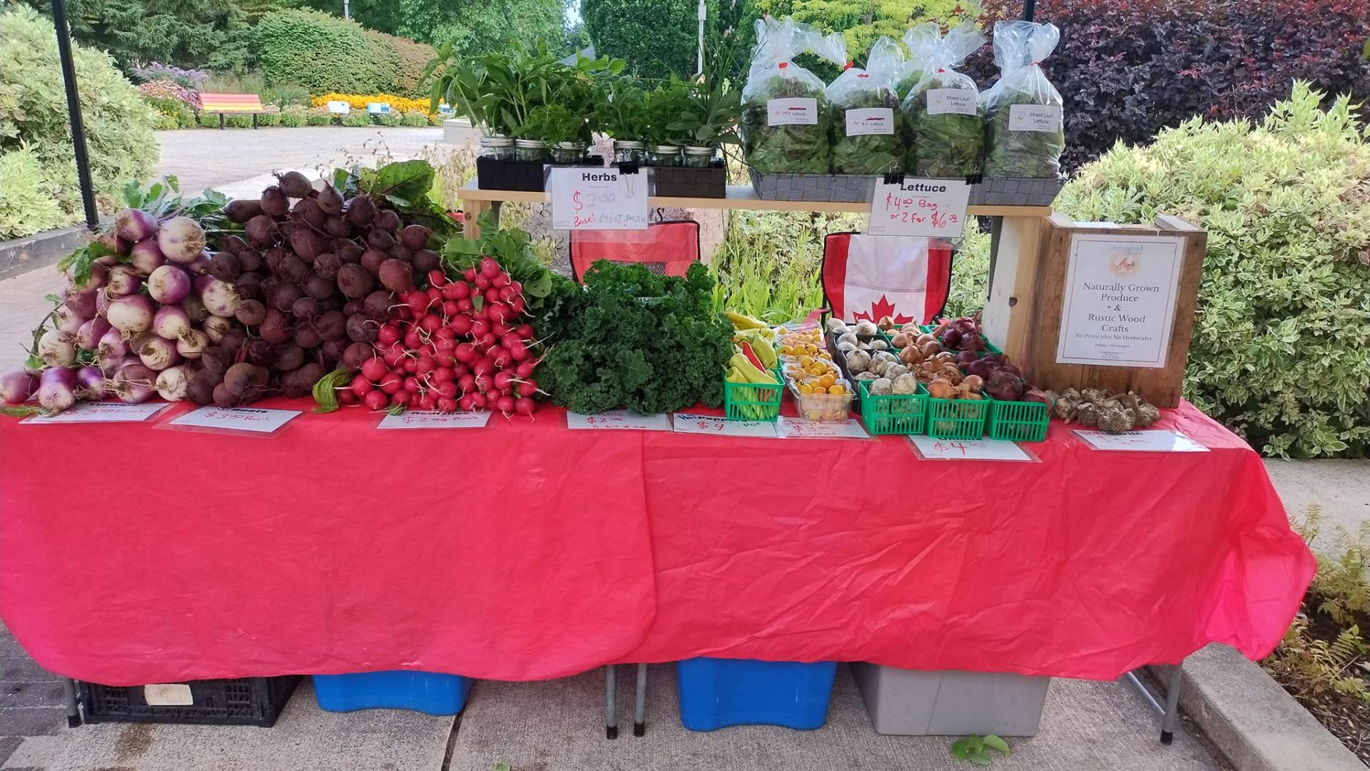 Product stand at Eat Well Farmer's Market in Hanover