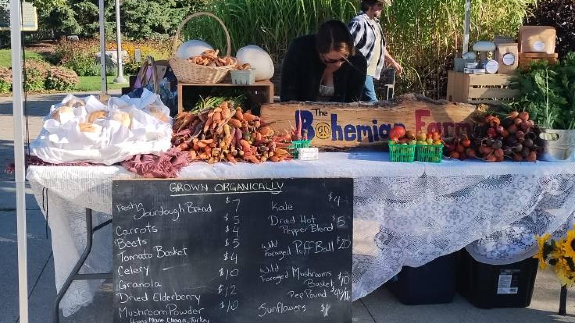 Vendor Booth with fresh vegetables at Eat Well Farmers' Market in Hanover