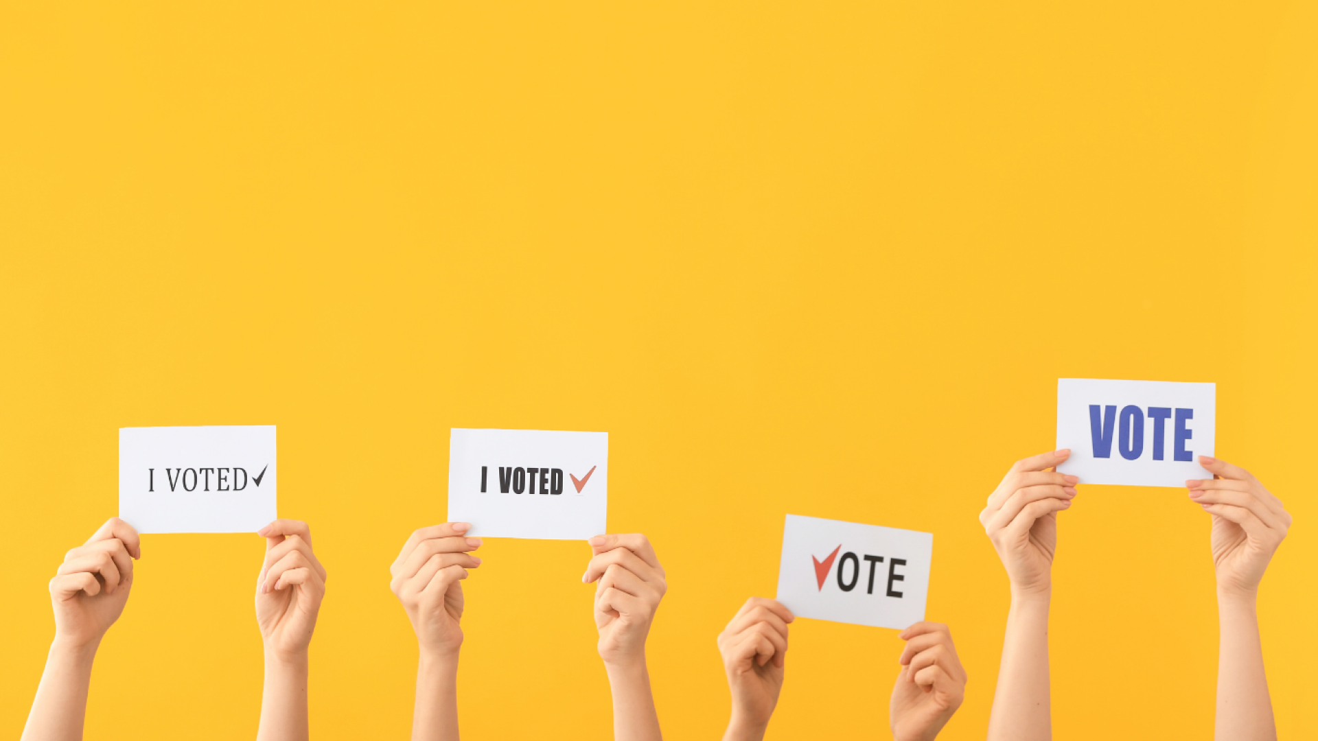 Yellow background with four sets of hands holding up signs that say "I voted"