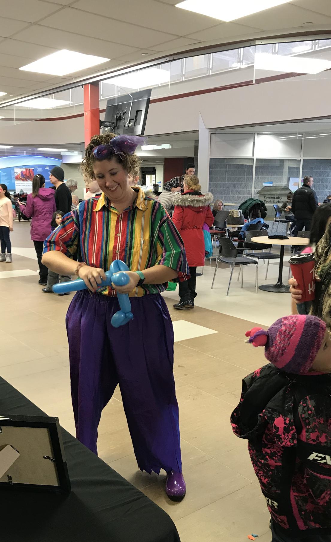 Clown making balloon animals 