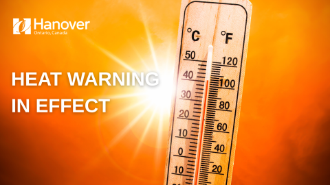 Photo of an orange sun with a thermometer, the Town of Hanover logo and text that says heat warning in effect